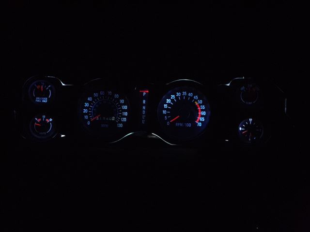 This is the original gauge cluster with white LEDs for illumination.  Also Note the 3 Speed Auto in-dash gear indicator.