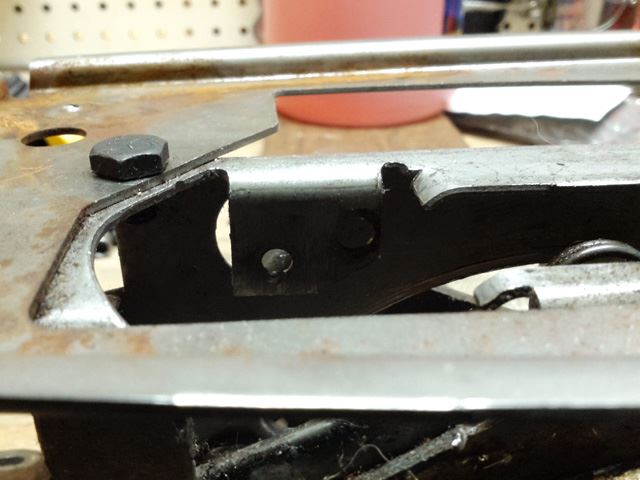 This is what the shifter looks like with the shift detent removed.  Near Low 1 is where one of the two rivets for the detent plate was located.  The lower hole (of the two) is where the rivet was.