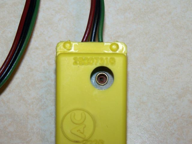 You can see the part number here (25007318).  This part has been discontinued by GM.  The newer versions are green with a mounting tab and have a four pin connector.  Although discontinued they can still be found new or used from the usual sources.  They range in price from about 20 to 80 dollars depending where you find one.  I got very lucky and found this one on eBay for $8.95.