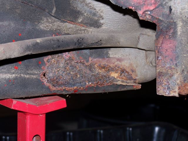 Another shot of the subframe.  It looks worse in real life.  In these pictures the bulging rust scale appears to fill in the hole.