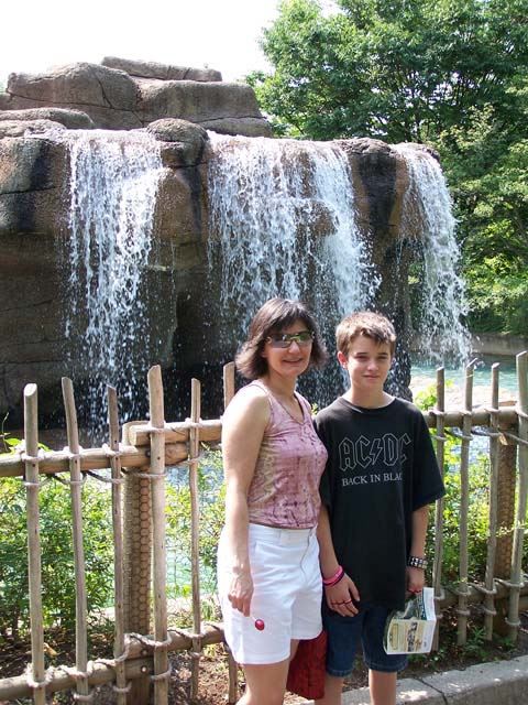 Michael and Kristina standing in front of Monkey Island's waterfall.  Michael was like no more pictures dad...gosh.