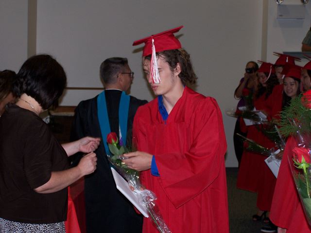 Michael gets a flower and a small gift for the class of 2012.