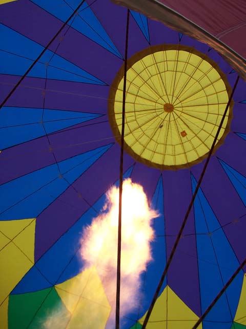 This a nearly fully inflated hot air balloon and a few more seconds of heat and it will be ready.