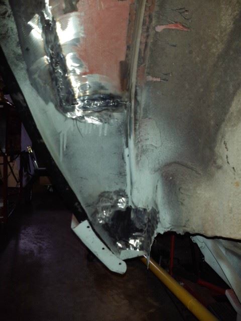 Inside the wheel well looking forward.  I ran out of welding gas so those two small spots still need to be welded.