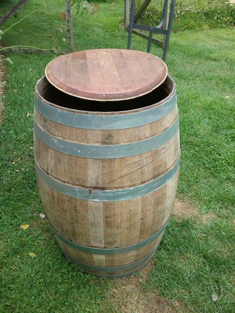 I don't have a before image but the old wine barrel was stored outside and was a little dirty.  I pressure washed it and weeks later removed the top.  This was the start of the construction phase.