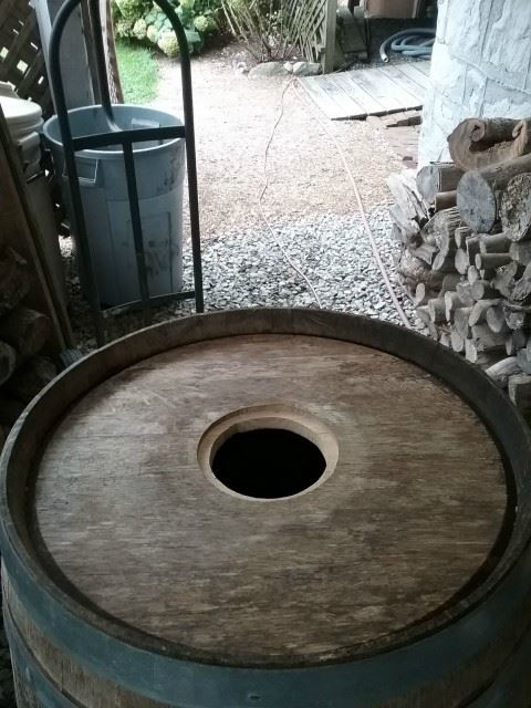 I flipped the barrel over, found the center of the bottom, and cut a hole for the subwoofer.