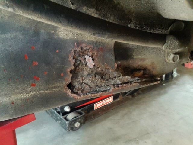 This the sub frame under the rear passenger's seat.  It looks pretty bad.