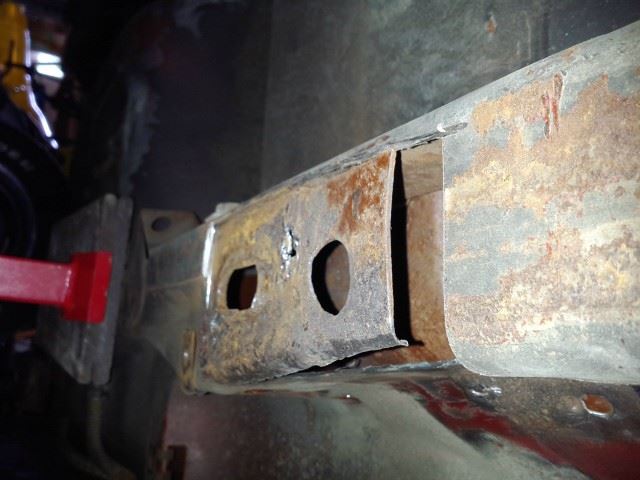 From the bottom you can see the one spot weld was holding pretty good, the small hole between the two larger holes.
