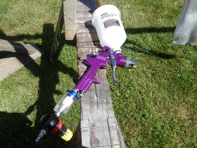 I got this from Harbor Freight just for this job.  It's the $10 sprayer (on sale) and when set up correctly it did a fine job.  The coating I used contains aluminum powder to help seal the metal from further corrosion.  This sprayer handled the material just fine (no thinning required).